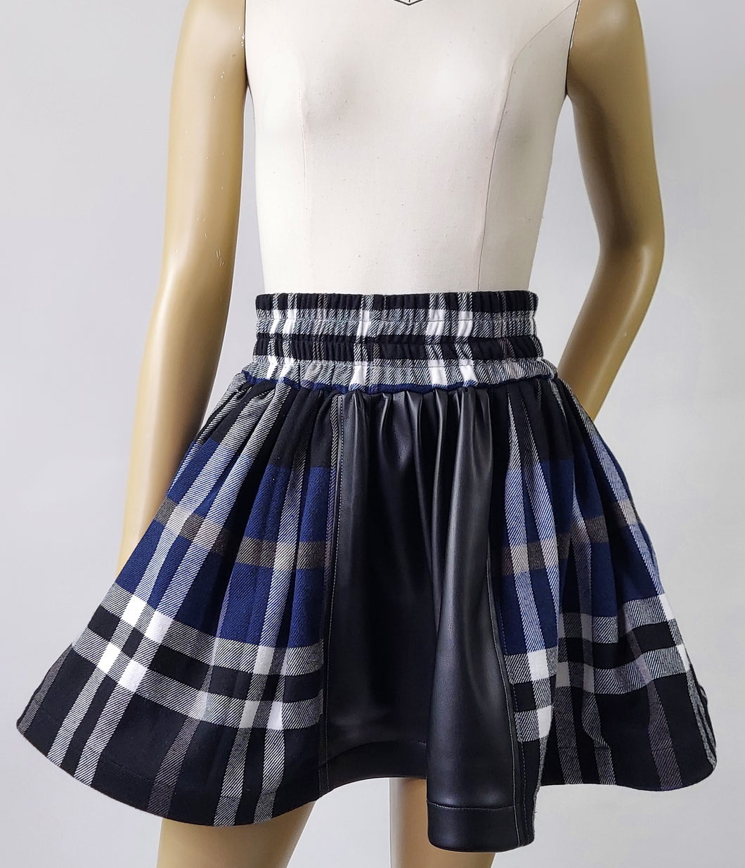 The plaid and leather mini